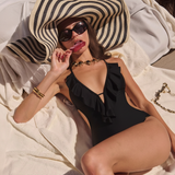 Model in Black Swimsuit on Beach Blanket