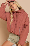 Designed in quilted jacket with zipper closure